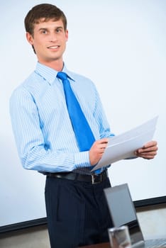 image of a businessman in the office with business papers
