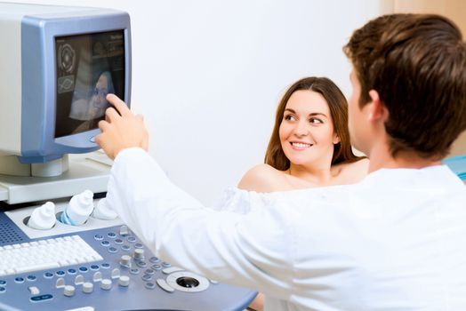 young pregnant woman on the ultrasound, health check