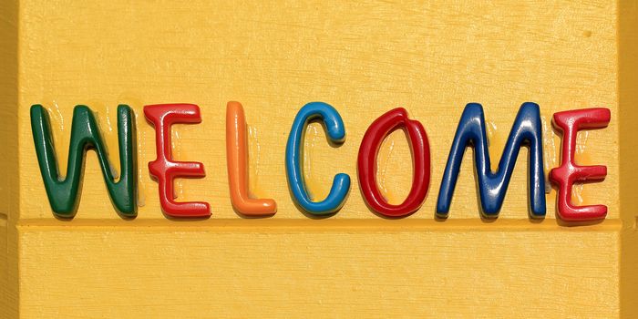 colorful of the welcome word on yellow plate