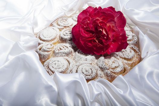 roses cake for mother day on  a fabric  background 