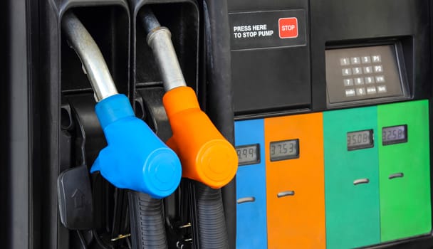 Gas pump nozzles in a service station