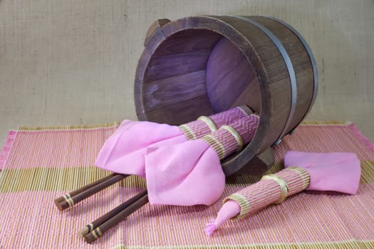 chopsticks in wood bucket