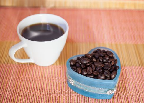 Cup of hot drink with coffee beam's