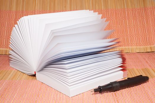 White opened booknote with blank pages