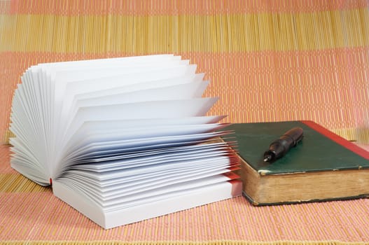 White opened booknote with blank pages