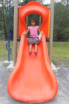 Asian little girl enjoy playground outdoor