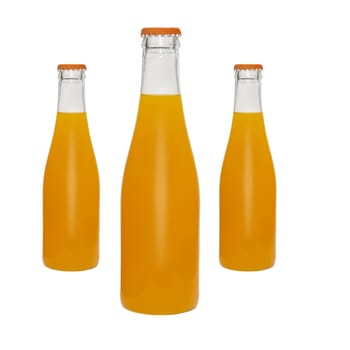 Bottles of orange juice on white background