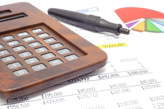 A calculator next to financial documents.