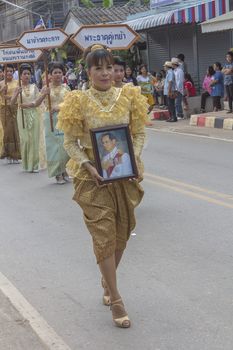 THAILAND - OCTOBER 20: Unidentified woman participates in "Ngan Chak Pra", a traditional buddhist festival on October 20, 2013 in Chaiya,Suratthani, Thailand.