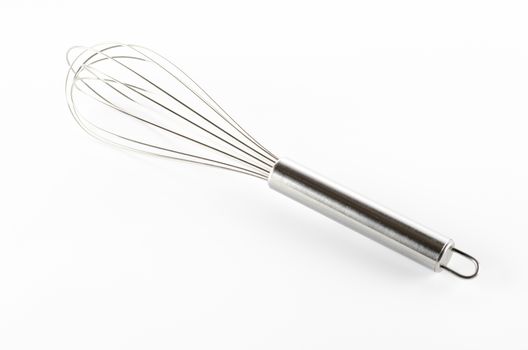 kitchen tools egg whisk on a white background