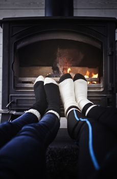 Feet with socks at the campfire