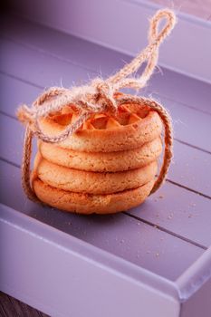 Four biscuits in a pack bound with a rope