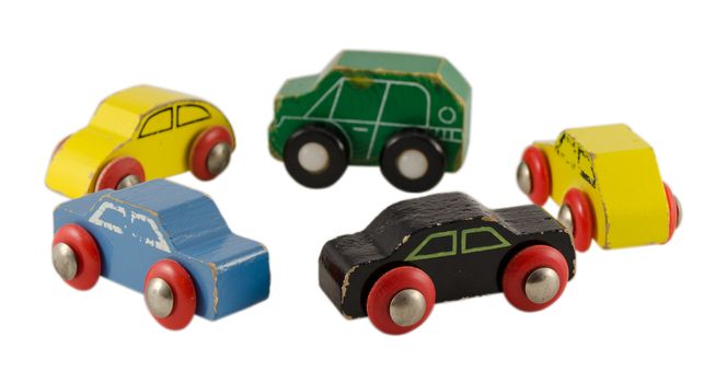 retro wooden colorful cars toy standing in circle isolated on white background