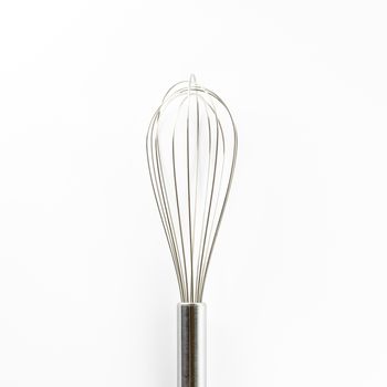 kitchen tools egg whisk on a white background