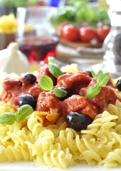 Italian pasta dish with tomato sauce and basil 