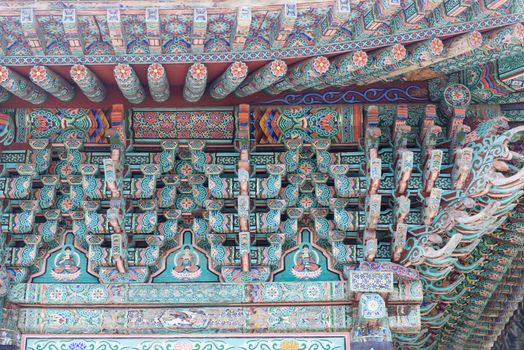 Colorful art of paintings on wood at a korean buddhist temple