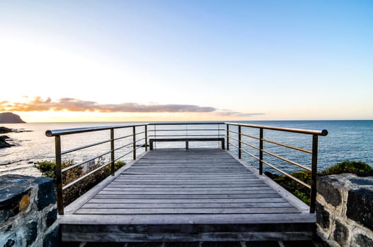 Sunrise on a Pier over Atlantic Ocean in Tenerife Canary Islands Spain