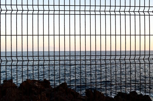 Net over the atlantic ocean at sunset