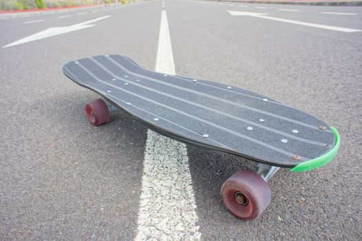 Hdr Picture Vintage Style Longboard Black Skateboard on an Empty Asphalt Desert Road