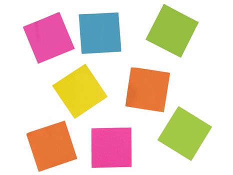 white wall with papers in green yellow blue pink and orange
