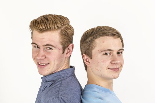 portrait of handsome brothers posing in studio