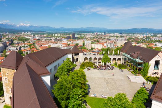 Panorama of the Slovenian capital Ljubljana and Ljubljana castle. Alps mountains in the background.