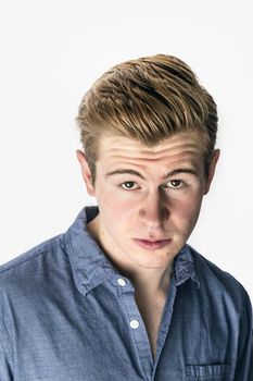 portrait of cool boy with red hair posing in studio