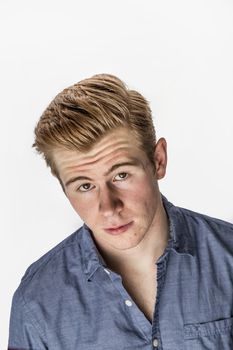 portrait of cool boy with red hair posing in studio