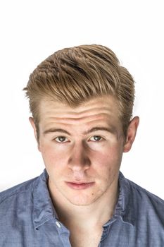 portrait of cool boy with red hair posing in studio