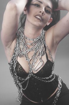 Model, Beautiful brunette woman with big silver chains chained