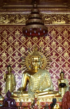 golden buddha image at temple hall,Chiangrai temple,Thailand