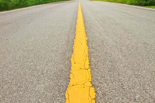 Asphalt dark texture with yellow lines