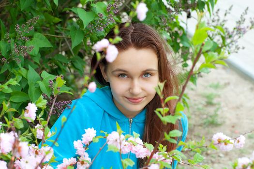 portrait of a girl in spring flowers