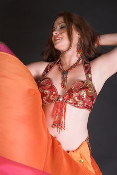 Belly Dancer wearing a red costume with jewelery