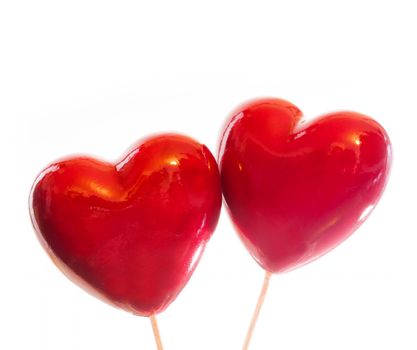 Two red hearts isolated on white, symbol of love, Valentine's Day, romantic couple.