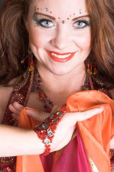 Belly Dancer wearing a red costume with jewelery