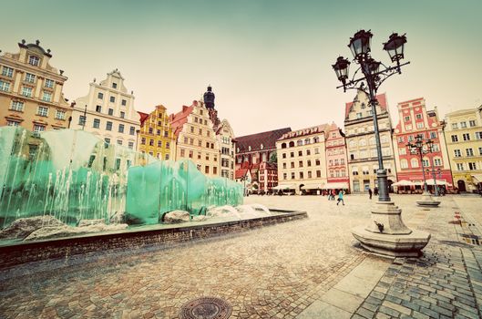 Wroclaw, Poland. The market square with the famous fountain and colorful historical buildings. Vintage, retro
