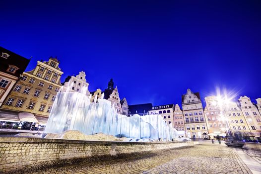 Wroclaw, Poland. The market square and the famous fountain at night. Silesia region.