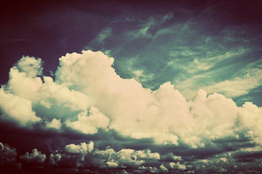 Sky with fluffy clouds. Retro, vintage style background