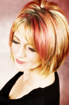 Beautiful blond female with red streaks in her hair