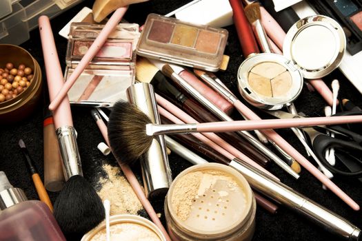 Various forms of make-up on a table