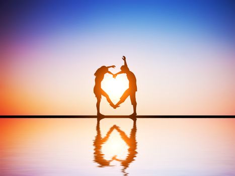A happy couple in love making a heart shape with their bodies at sunset with water reflection