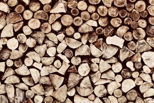 Pile of brown wood logs background, pattern. Vintage tone
