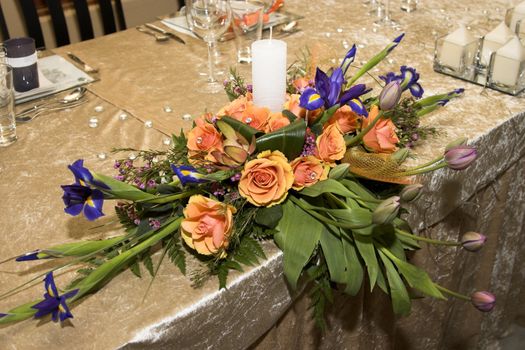 Wedding Table flower arrangement with orange roses
