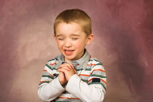 Young boy with short hair and beautiful facial expressions