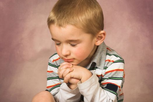 Young boy with short hair and beautiful facial expressions