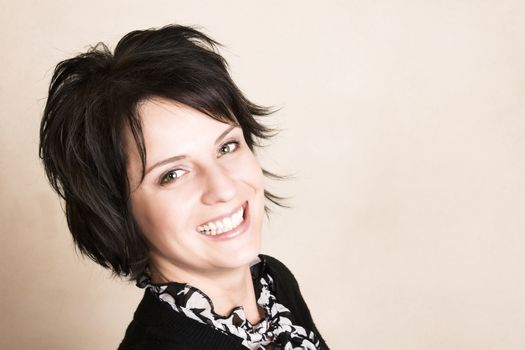 Studio shot of female brunette, head and shoulders