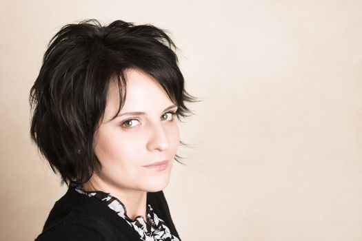 Studio shot of female brunette, head and shoulders