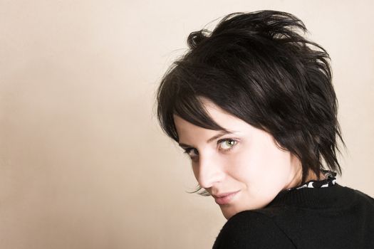 Studio shot of female brunette, head and shoulders