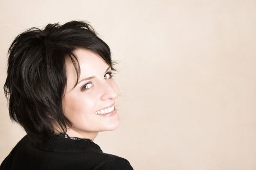 Studio shot of female brunette, head and shoulders